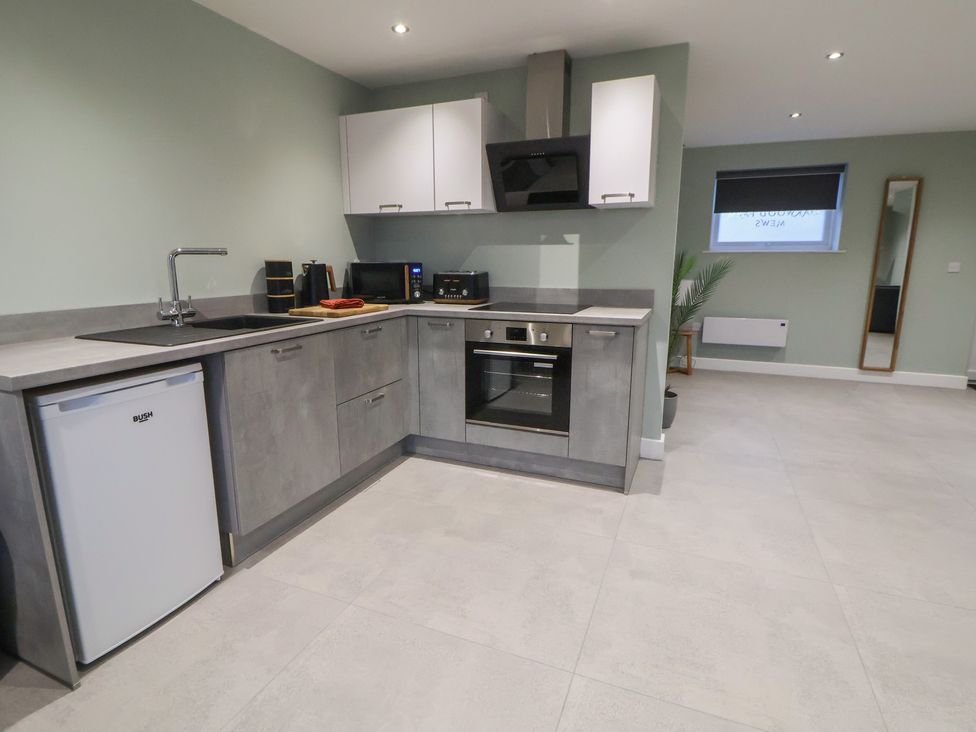 A kitchen with appliances and a sink at Ash Barn Chester