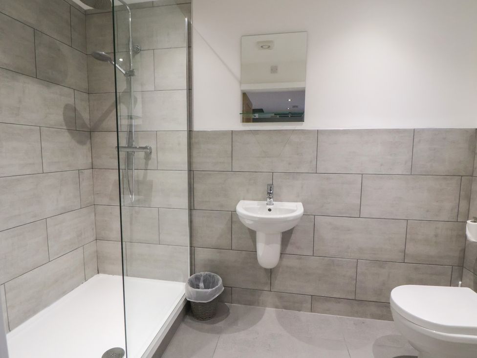 A bathroom with a shower, sink and toilet at Ash Barn in Chester