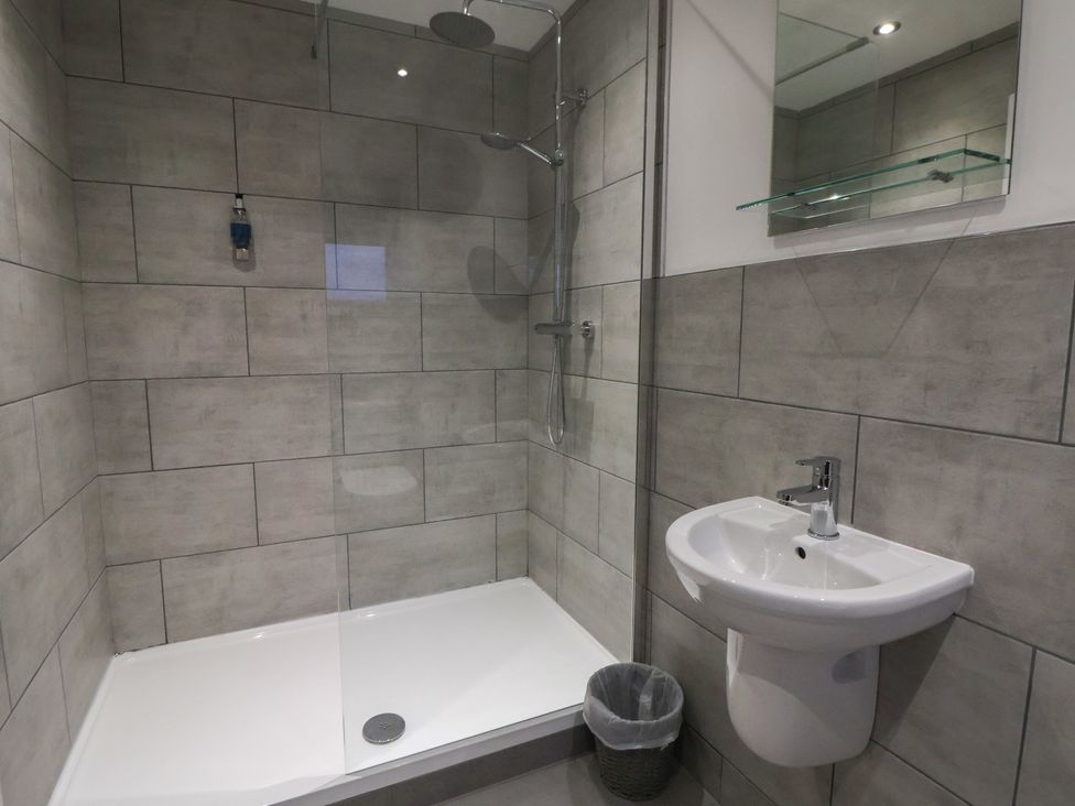 A bathroom with a shower and sink at Ash Barn in Chester