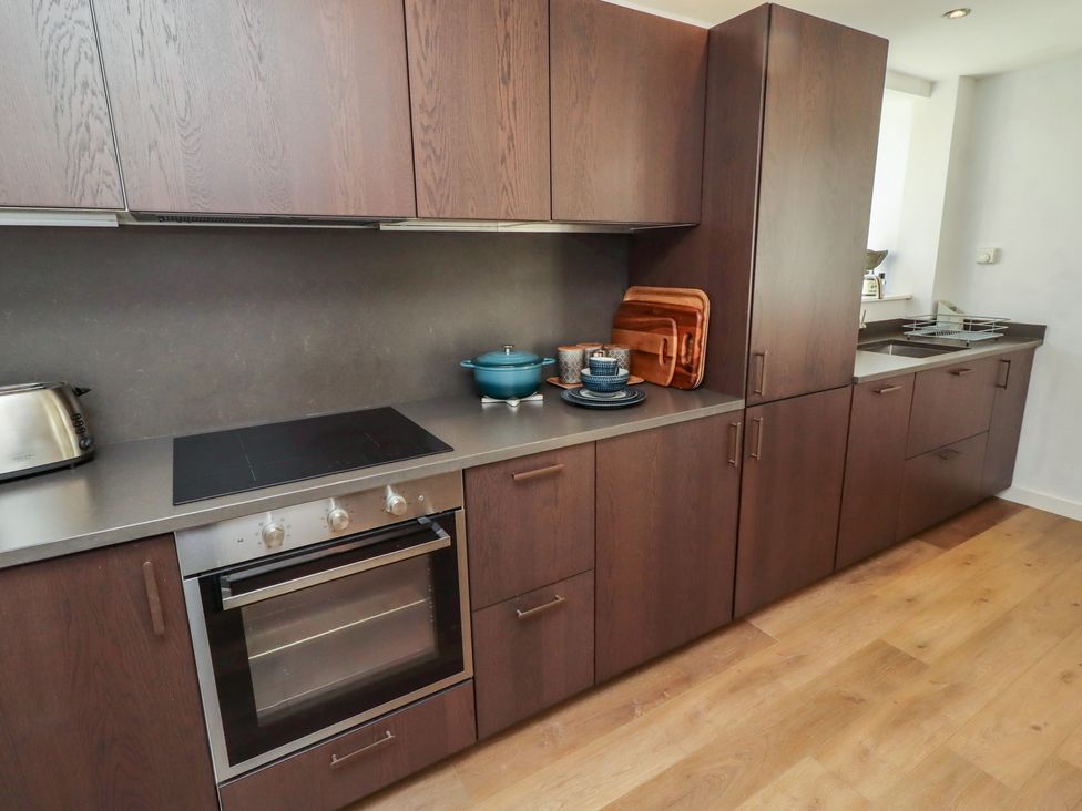 A kitchen with an oven and cooktop at Snowdrop Cottage near Warkworth