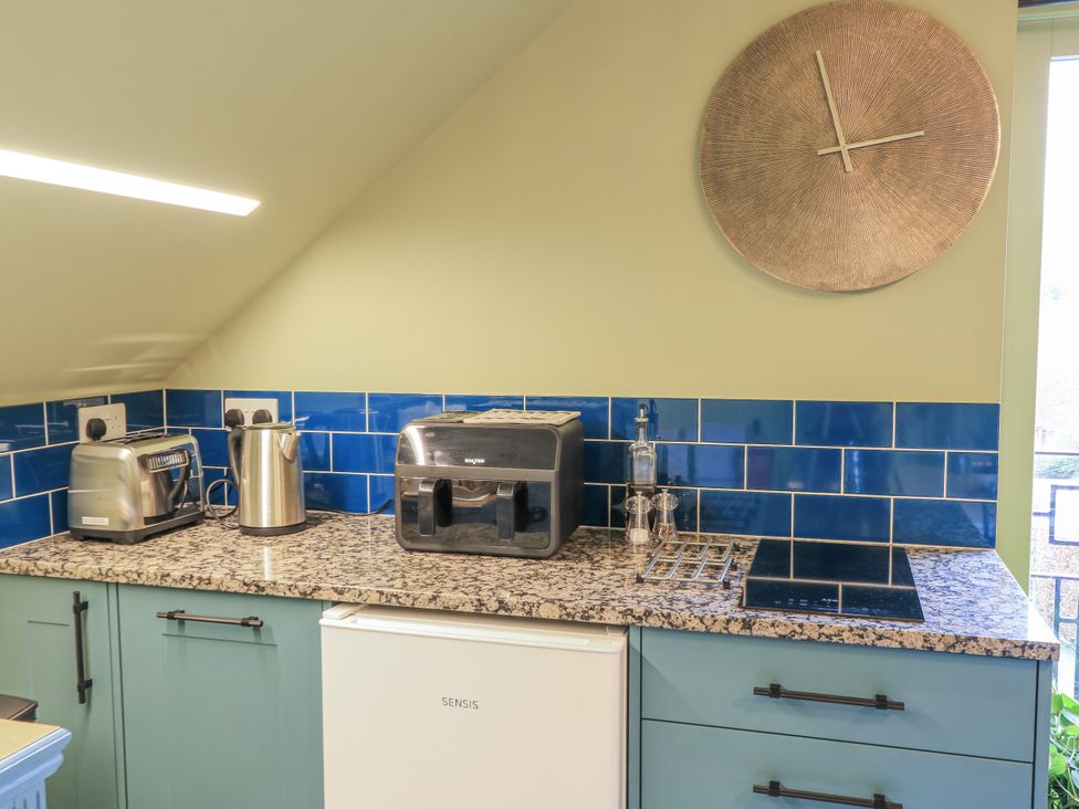 A kitchen with appliances on the counter at Golden Valley View in Stroud