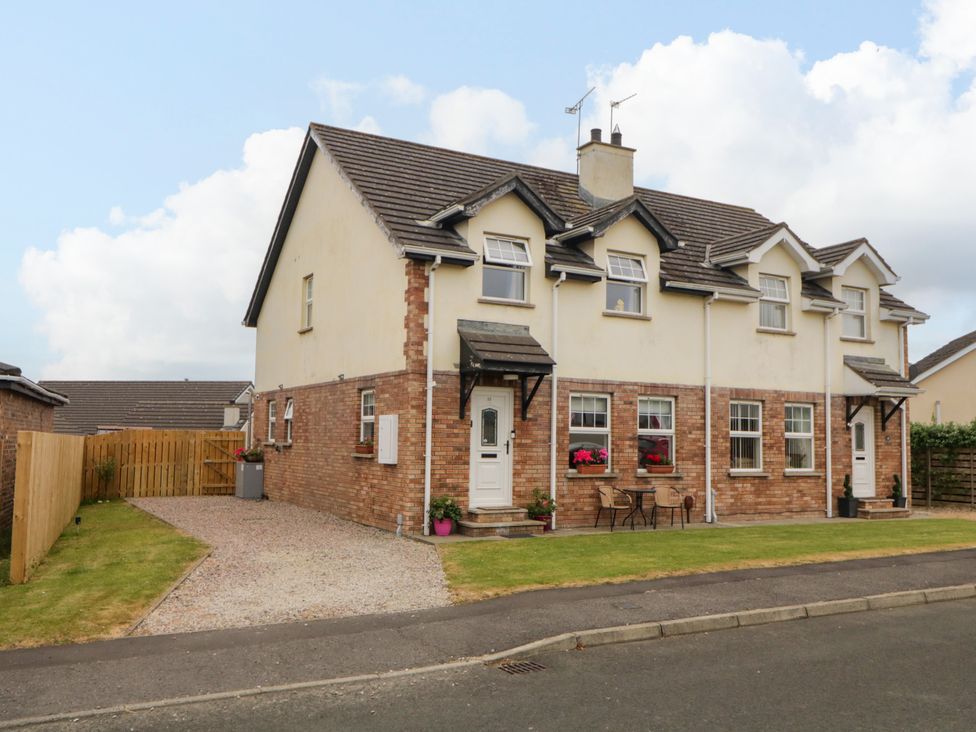 A house with a yard and furniture at Primrose Seaside Escape, Portrush, County Antrim
