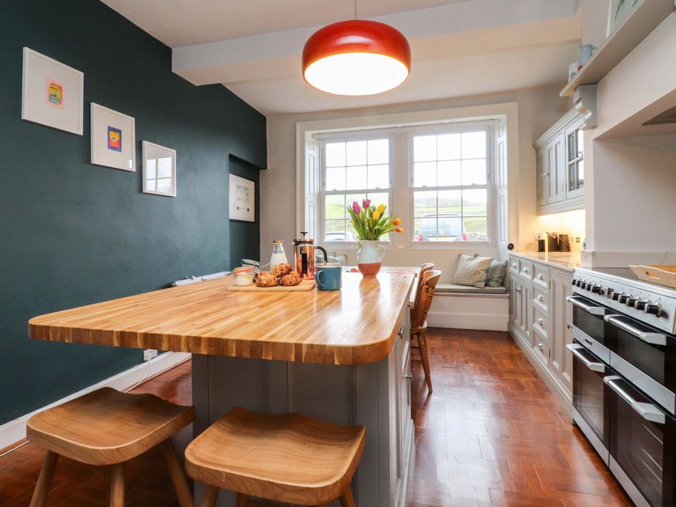 A kitchen with a wooden table and chairs at Kirk Yett in Skipton