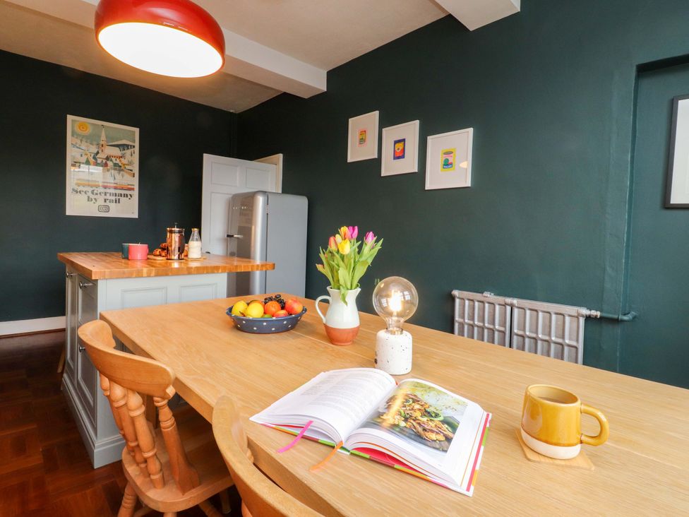 A kitchen with a table and chairs at Kirk Yett in Skipton