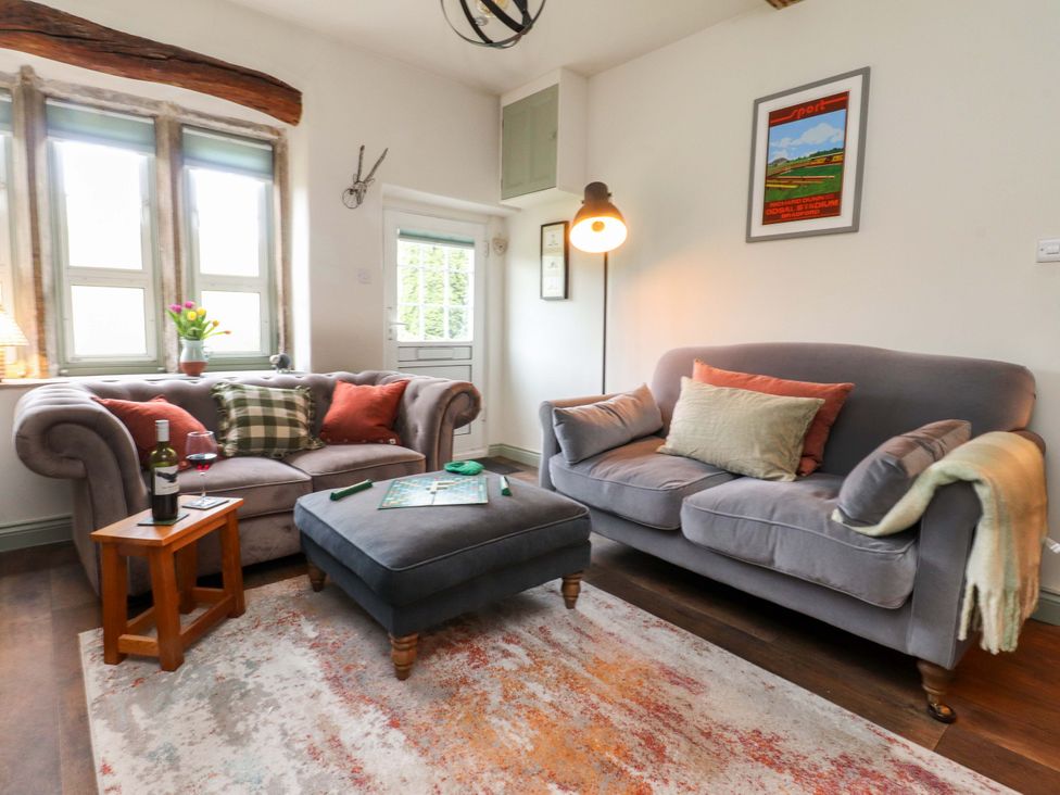 A living room with a sofa and coffee table at Kirk Yett in Skipton