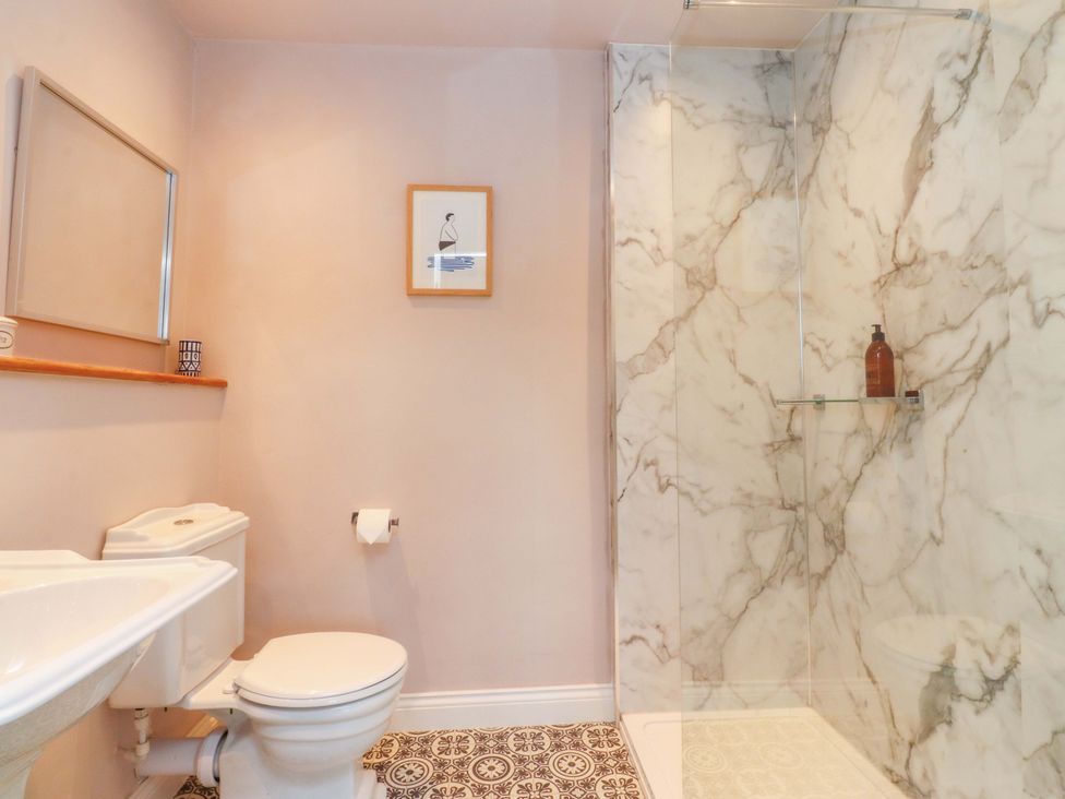 A bathroom with a shower and toilet at Kirk Yett in Skipton