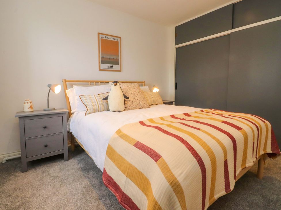 A bedroom with a bed and bedside table at Kirk Yett in Skipton