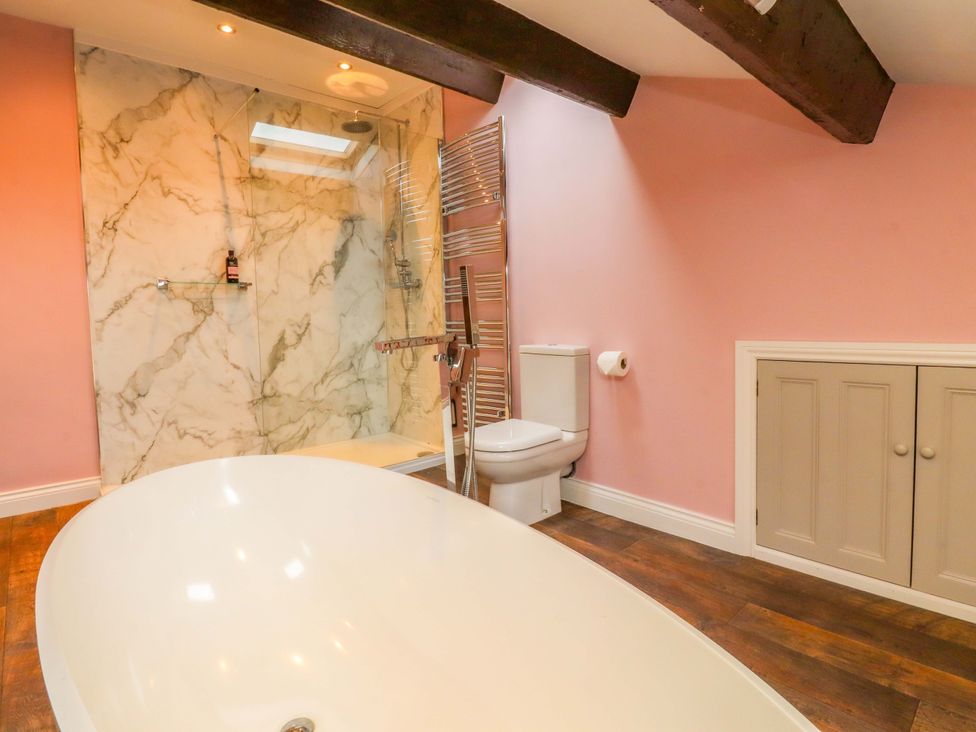 A bathroom with a bathtub and shower at Kirk Yett in Skipton