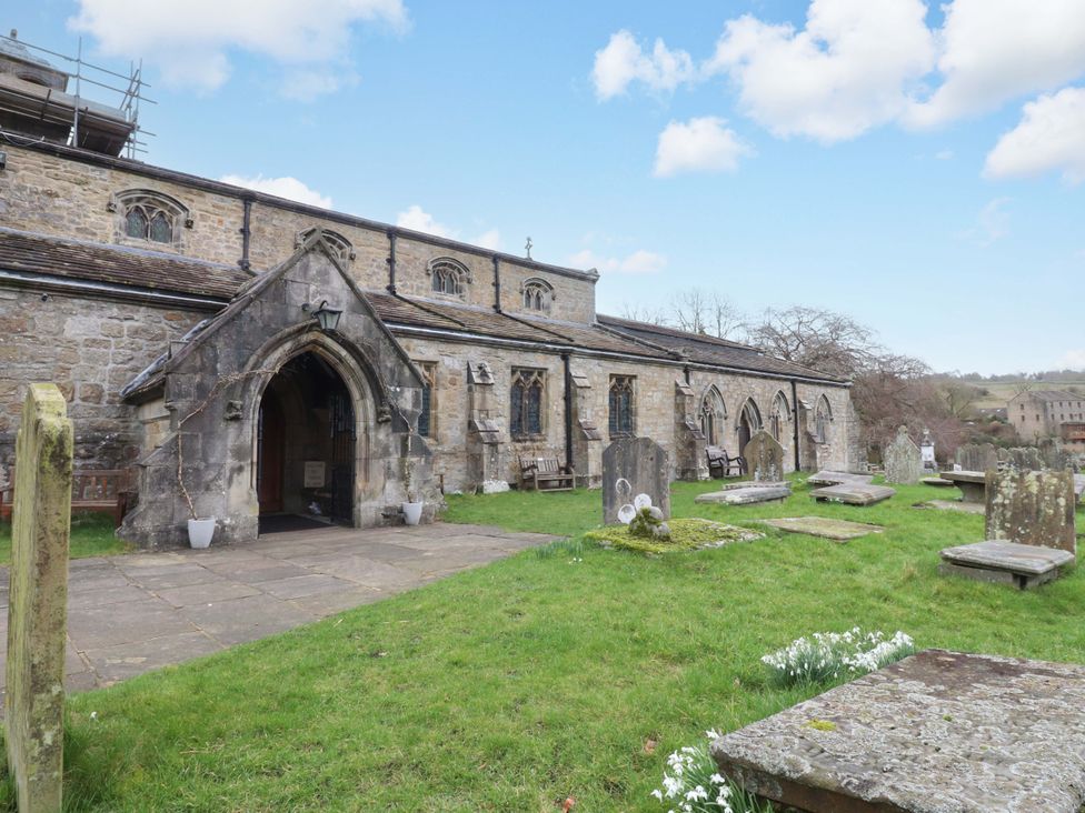 An outdoor view of a church with a graveyard at Kirk Yett in Skipton