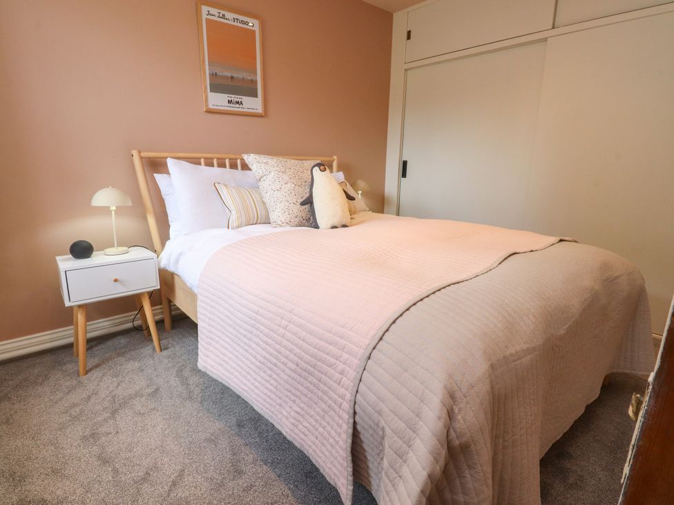 A bedroom with a bed and nightstand at Kirk Yett in Linton Falls near Skipton
