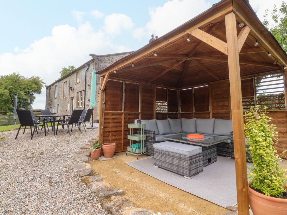 A gazebo with seating and a table at Kirk Yett in Linton Falls near Skipton