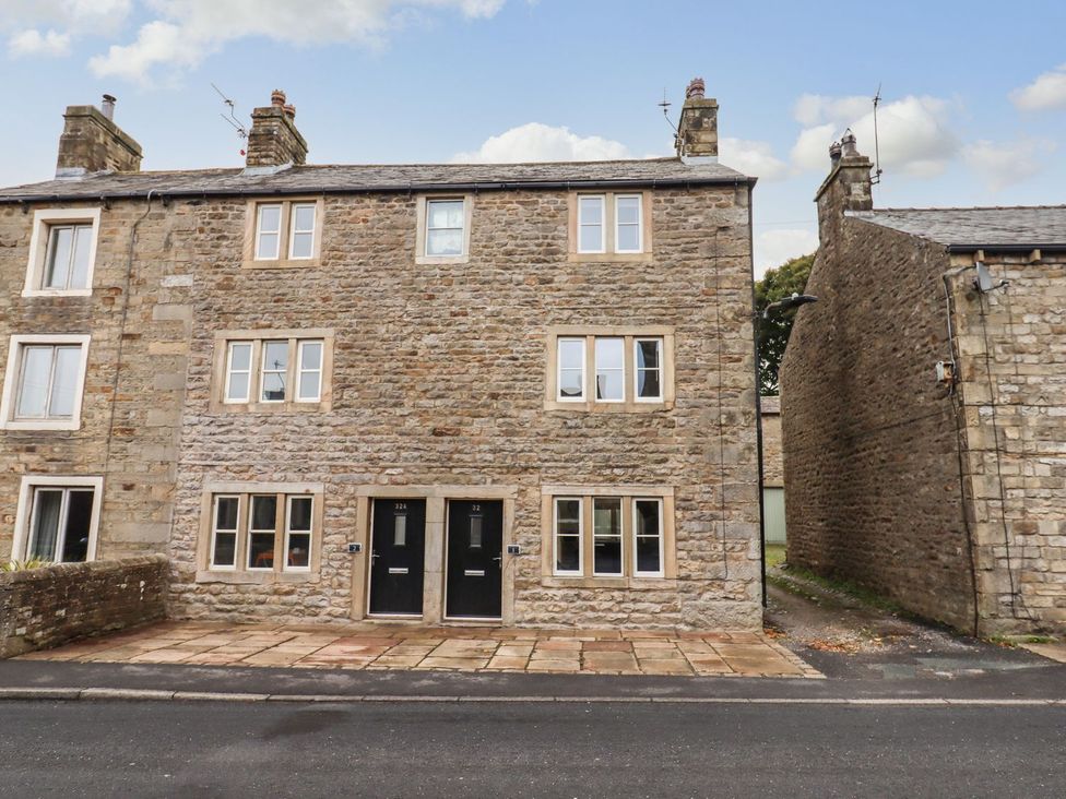 A building facade with windows and doors at 1 Grosvenor Farm Cottages Skipton