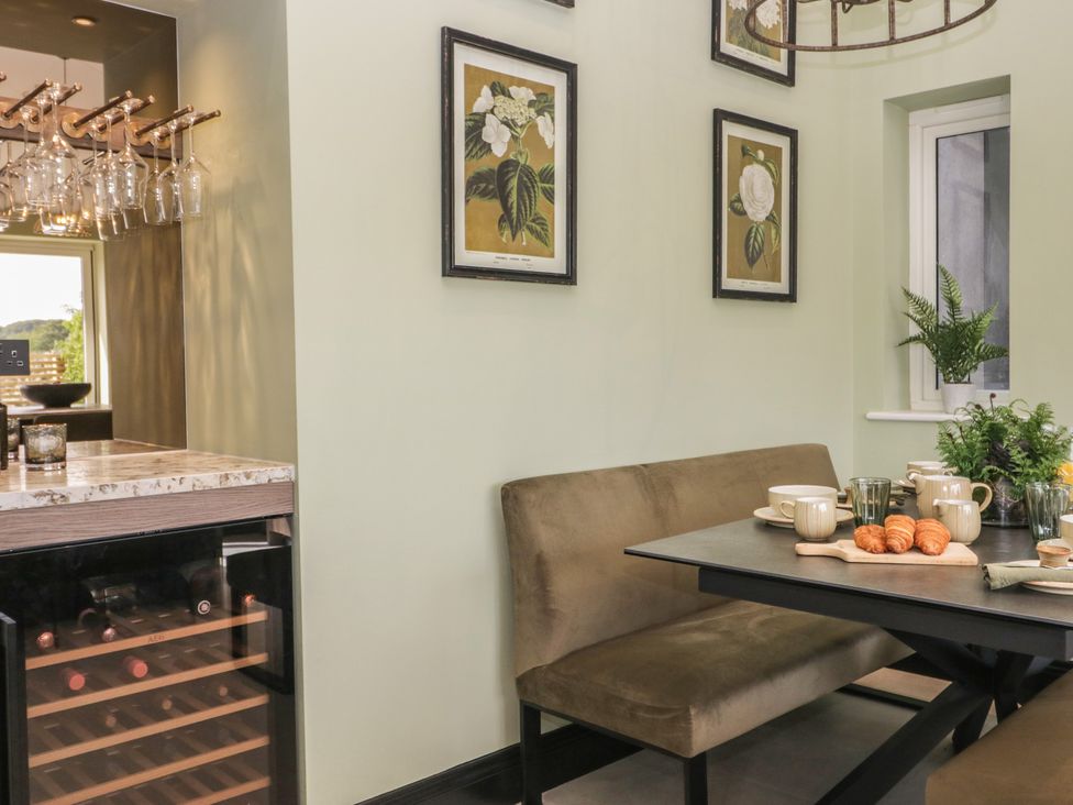 A dining room with a table and chairs at Low House Cottage Ayside near Newby Bridge