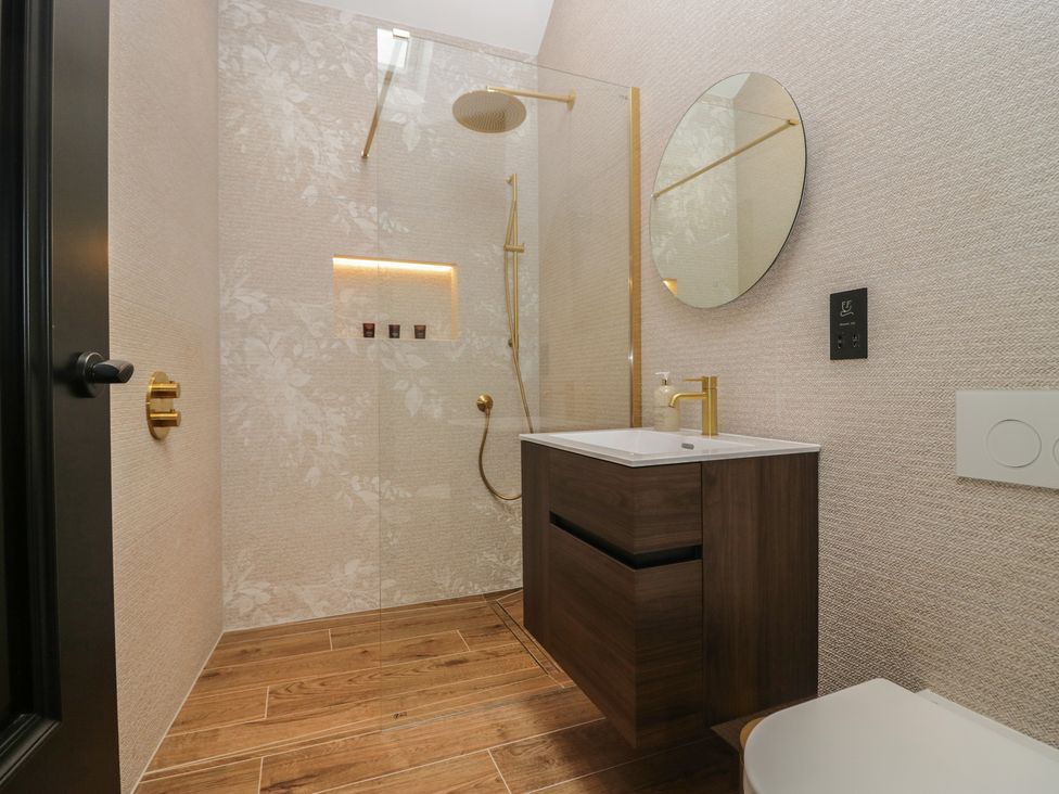 A bathroom with a shower and sink at Low House Cottage Ayside near Newby Bridge