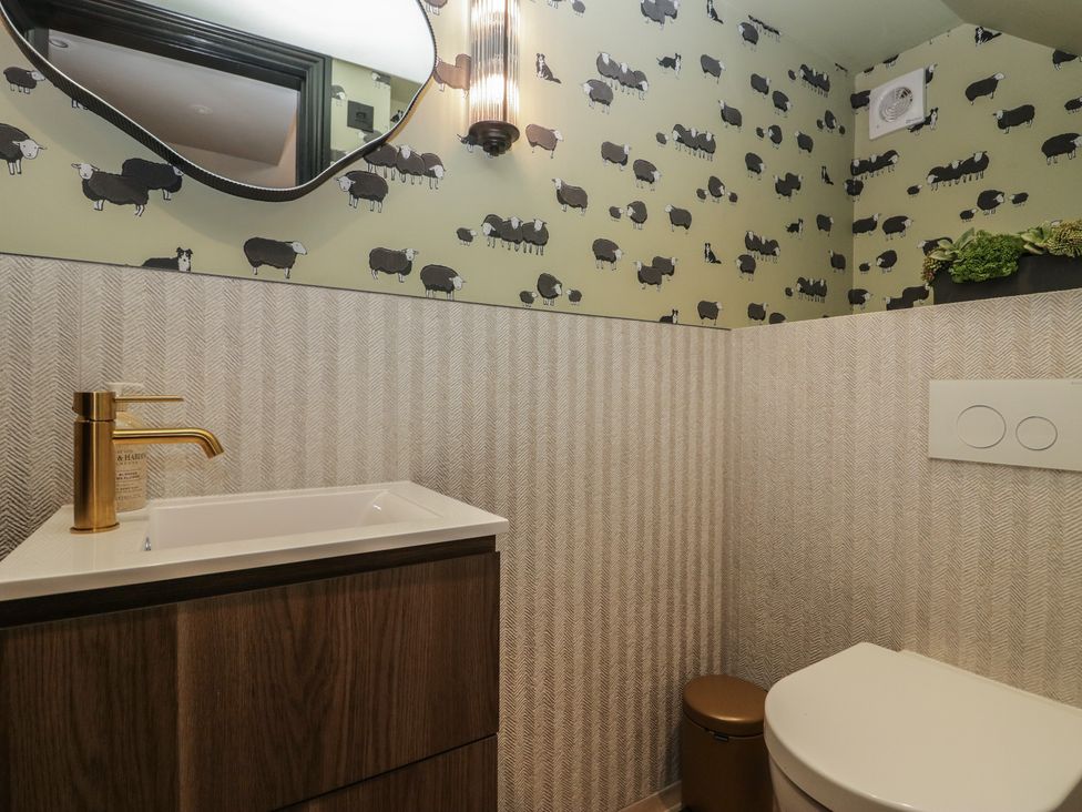 A bathroom with a sink and toilet at Low House Cottage Ayside near Newby Bridge