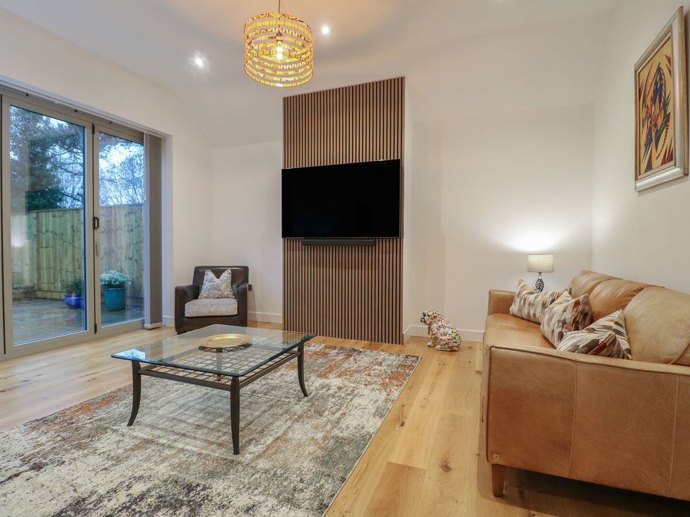 A living room with a sofa and coffee table at Oakwood Mews Matlock
