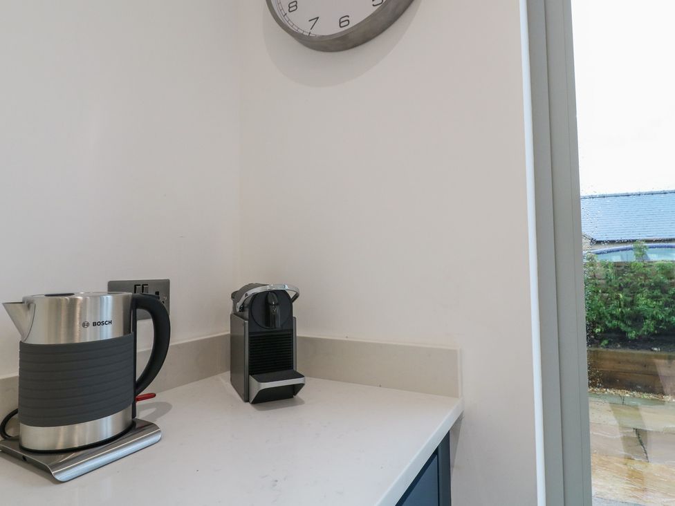 A coffee machine and electric kettle on a countertop at Oakwood Mews in Matlock