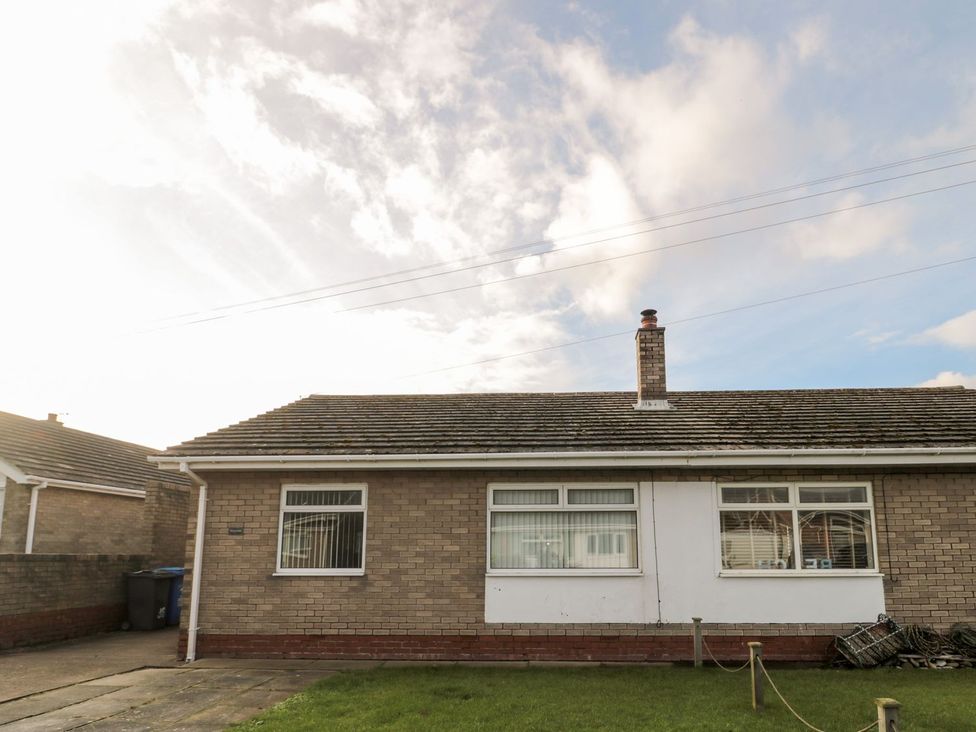 A bungalow exterior with windows at Megstone in Chathill