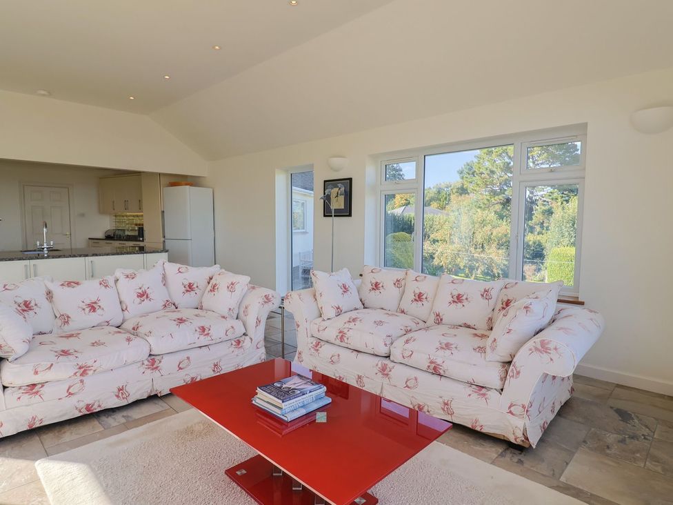 A living room with sofas and a coffee table at Hawksdown in Lyme Regis