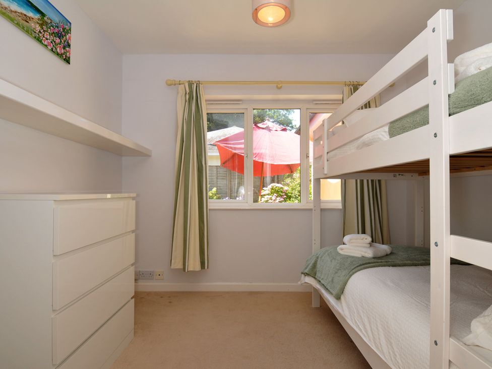A bedroom with a bunk bed and dresser at Jazmine in Dacre
