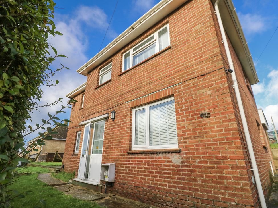 A brick house with a front door and windows at Red Brick Haven East Cowes, Isle Of Wight