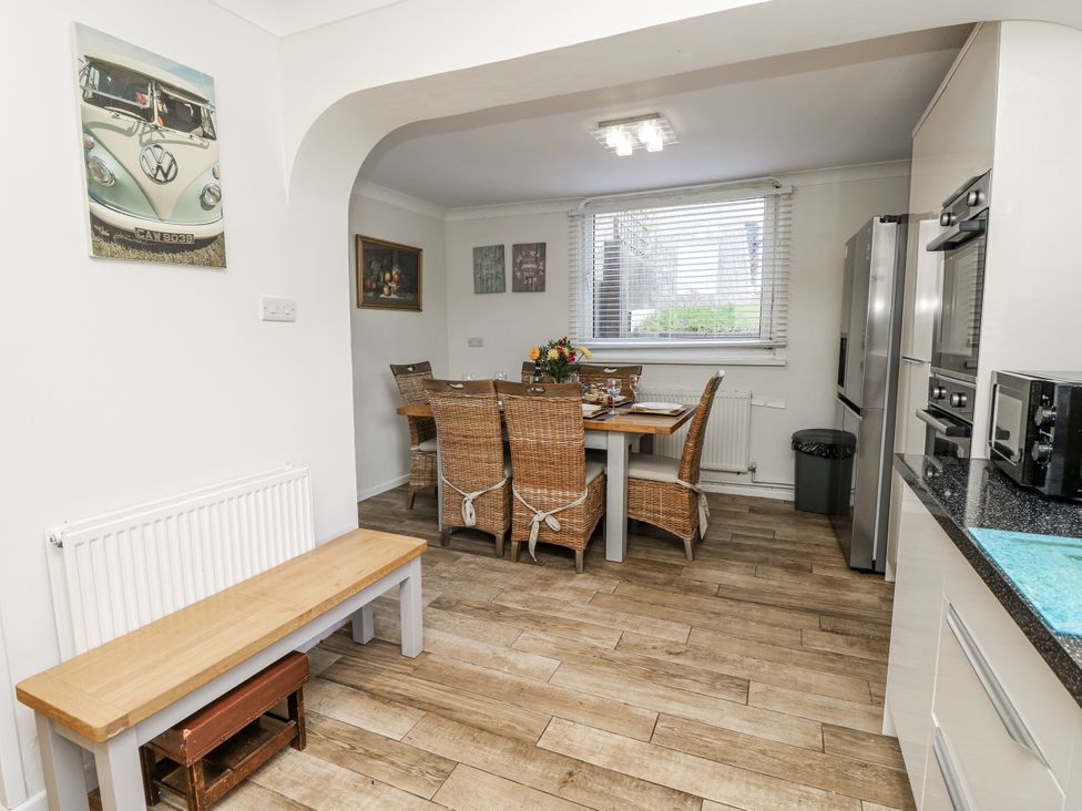 A kitchen with a table and chairs at Red Brick Haven in East Cowes, Isle Of Wight