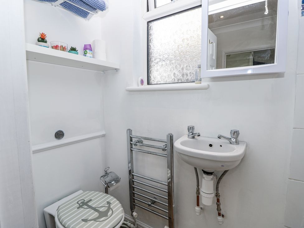 A bathroom with a toilet and sink at Red Brick Haven East Cowes, Isle Of Wight