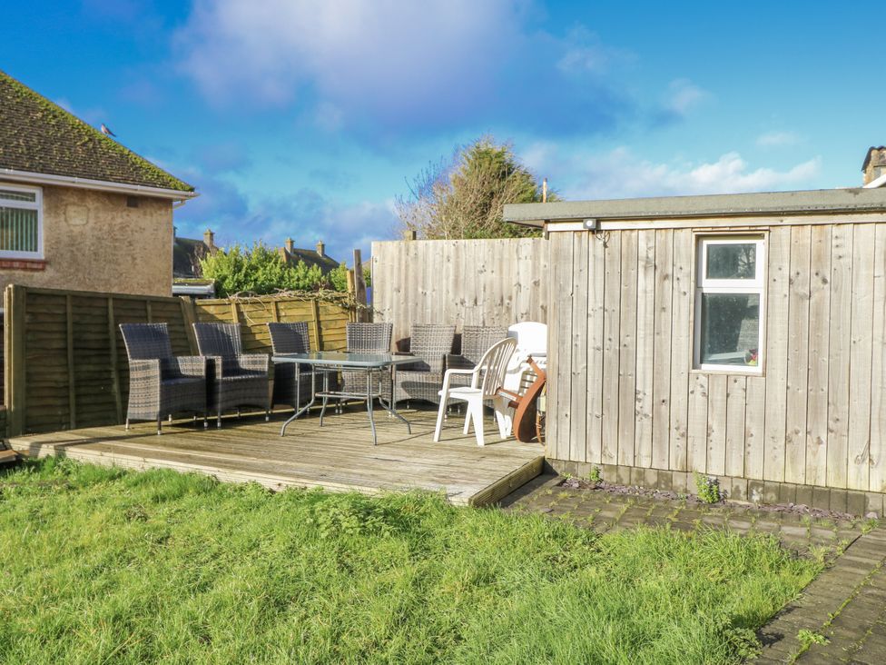 A garden with decking and outdoor furniture at Red Brick Haven East Cowes, Isle Of Wight