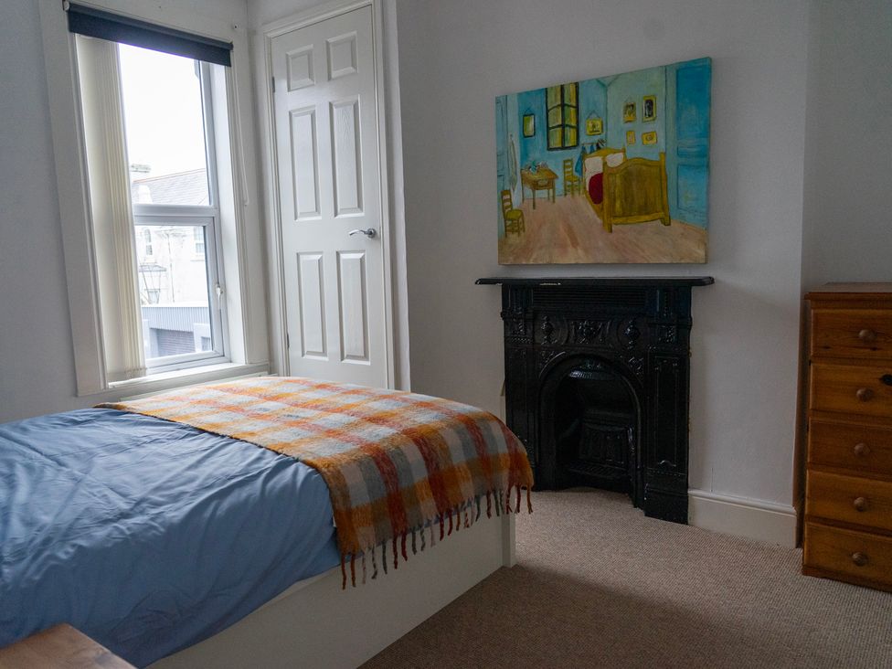 A bedroom with a bed and window at The Red Door in 