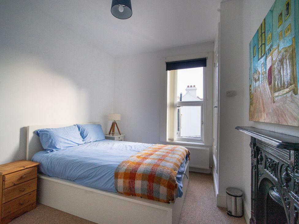 A bedroom with a bed and a window at The Red Door in Bangor