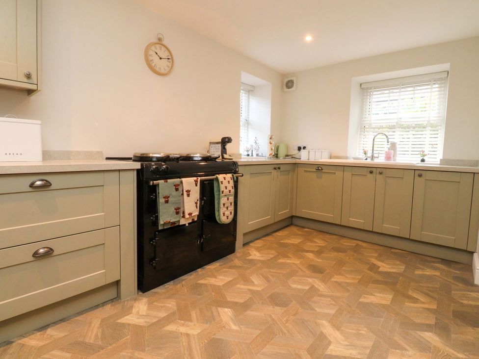 A kitchen with cabinets and an oven at Cowside Farm in Langcliffe near Settle
