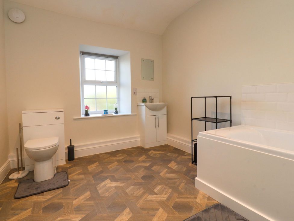 A bathroom with a sink and bathtub at Cowside Farm in Langcliffe near Settle