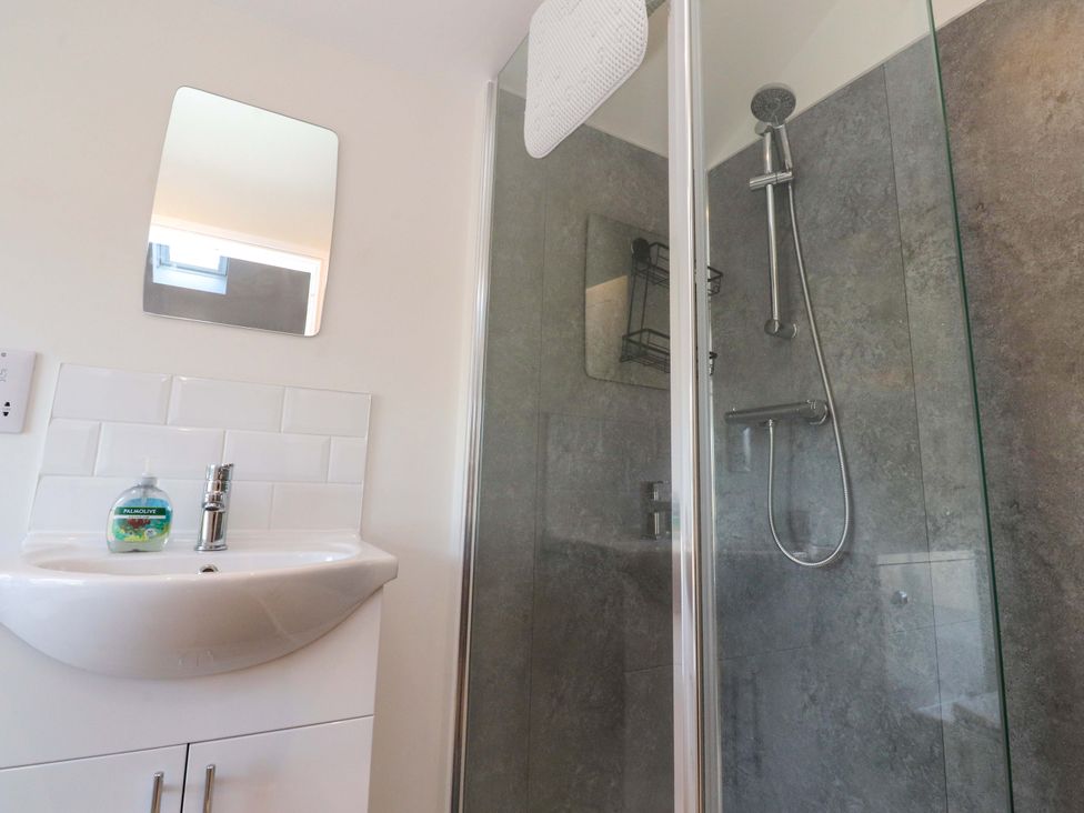 A bathroom with a sink and shower at Cowside Farm in Langcliffe near Settle