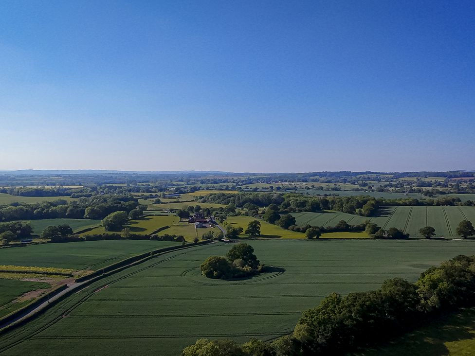 A panoramic view of fields and trees at The Lodge in Upton Warren