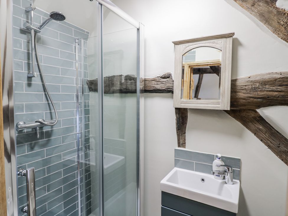 A bathroom with a shower and sink at Weston Cottage in Stratford-upon-Avon