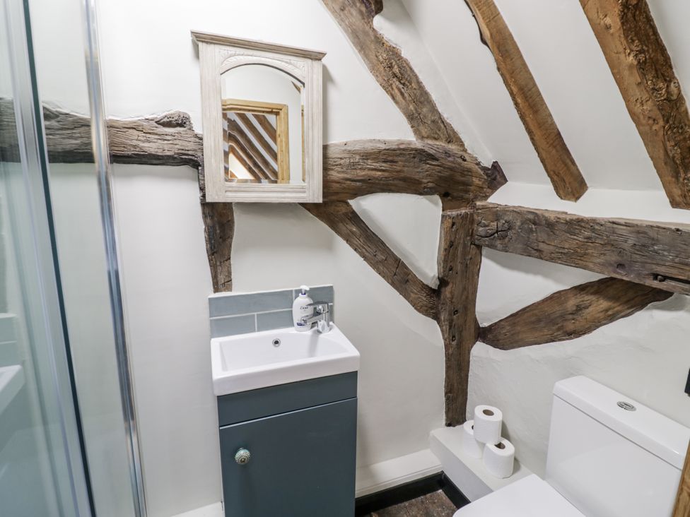 A bathroom with a sink, toilet, and shower at Weston Cottage in Stratford-upon-Avon
