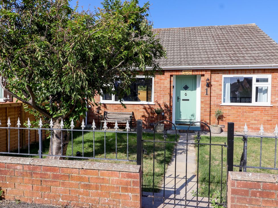 A house with a front door and garden at 1 Ashcott Place Burnham-On-Sea