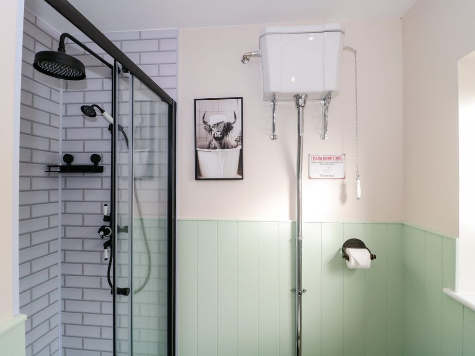 A bathroom featuring a shower and toilet at 1 Ashcott Place Burnham-On-Sea