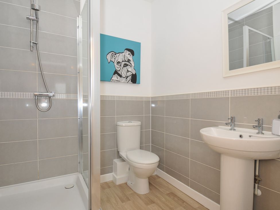A bathroom with shower, toilet, and sink at Sea Snug in Newquay