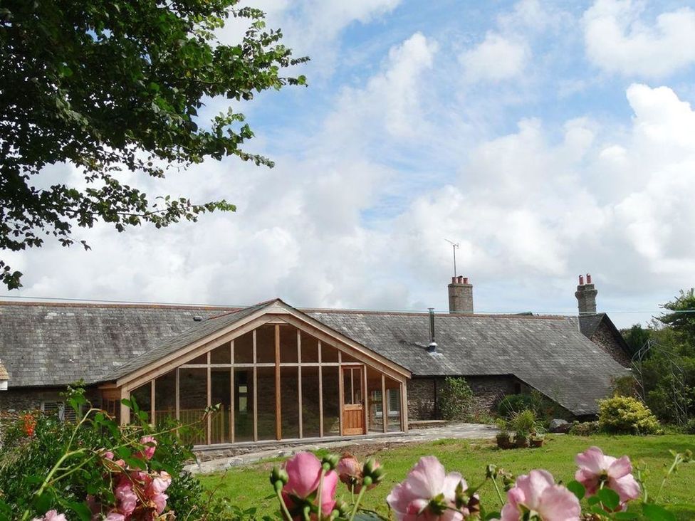 A building in a garden at The Cider Barn at Home Farm Down Thomas near Wembury