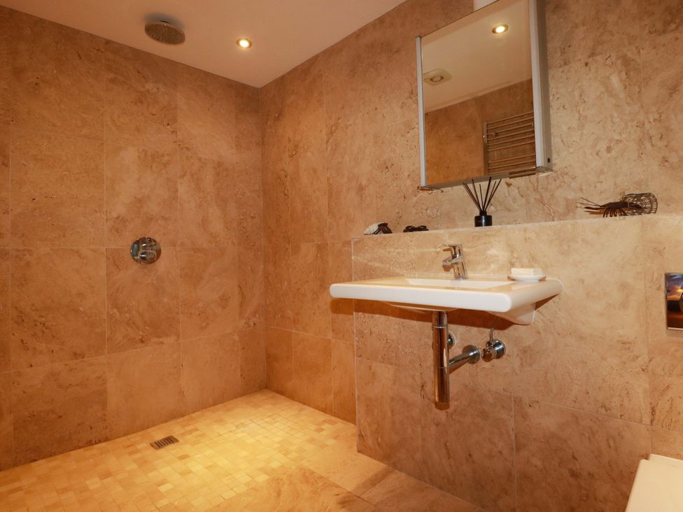 A bathroom with a shower and sink at Kerslake House in Crafthole