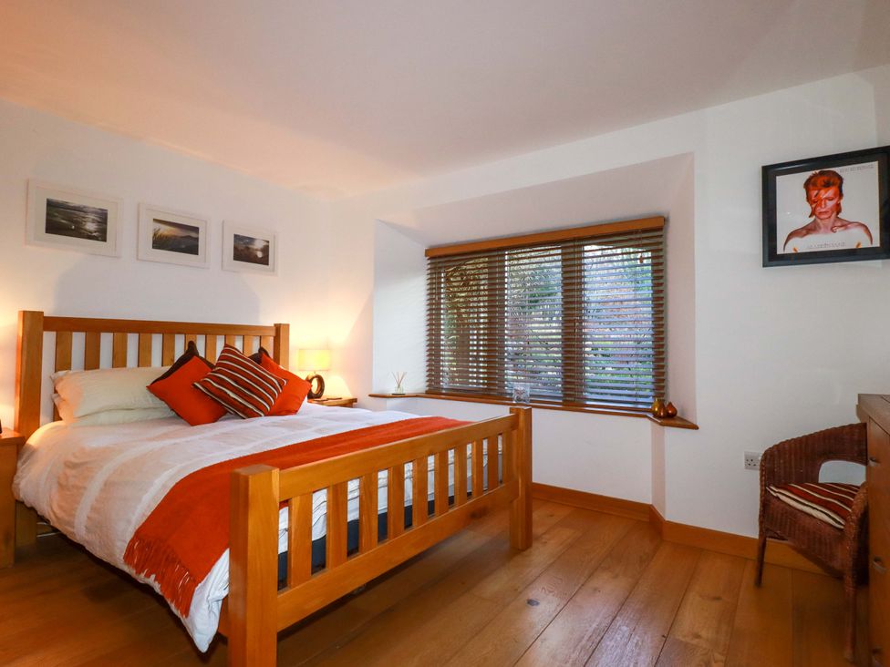 A bedroom with a bed and window at Kerslake House Crafthole