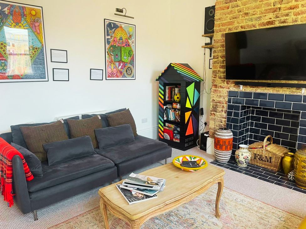 A living room with a sofa and television at 21 Gensing Road St. Leonards-on-Sea