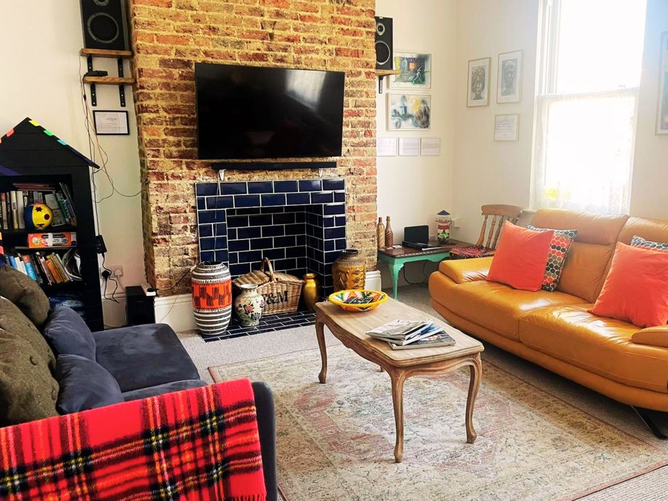 A living room with a sofa and a coffee table at 21 Gensing Road St. Leonards-on-Sea
