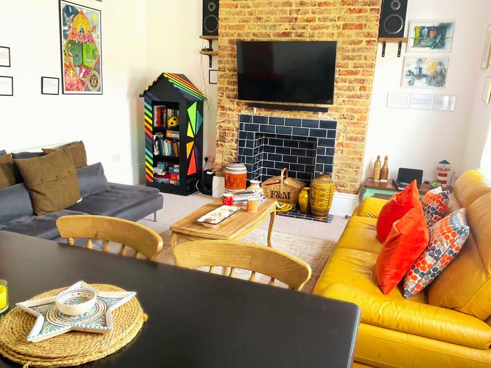A living room with a sofa and coffee table at 21 Gensing Road St. Leonards-on-Sea