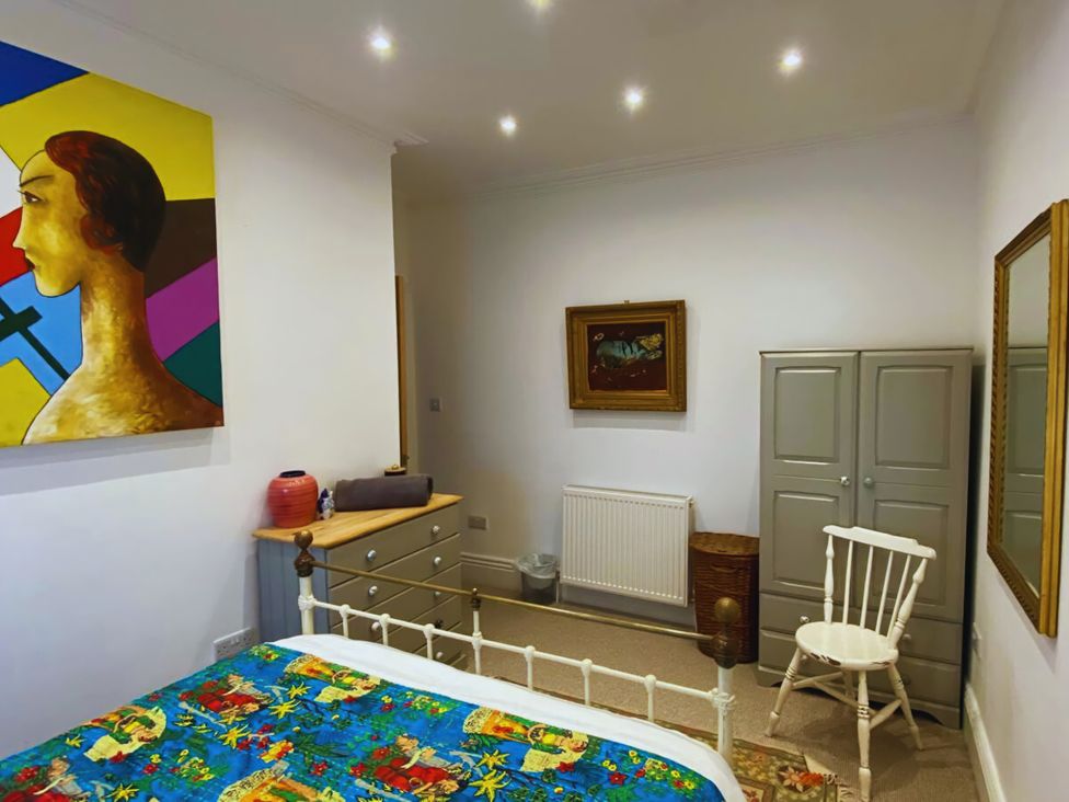 A bedroom with a bed and dresser at 21 Gensing Road St. Leonards-on-Sea