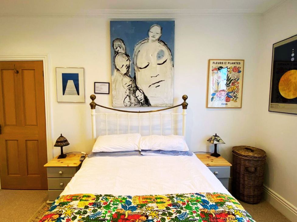 A bedroom with a bed and artwork at 21 Gensing Road St. Leonards-on-Sea