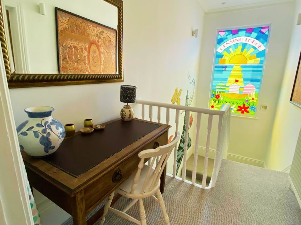 A hallway with a desk and painting at 21 Gensing Road, St. Leonards-on-Sea