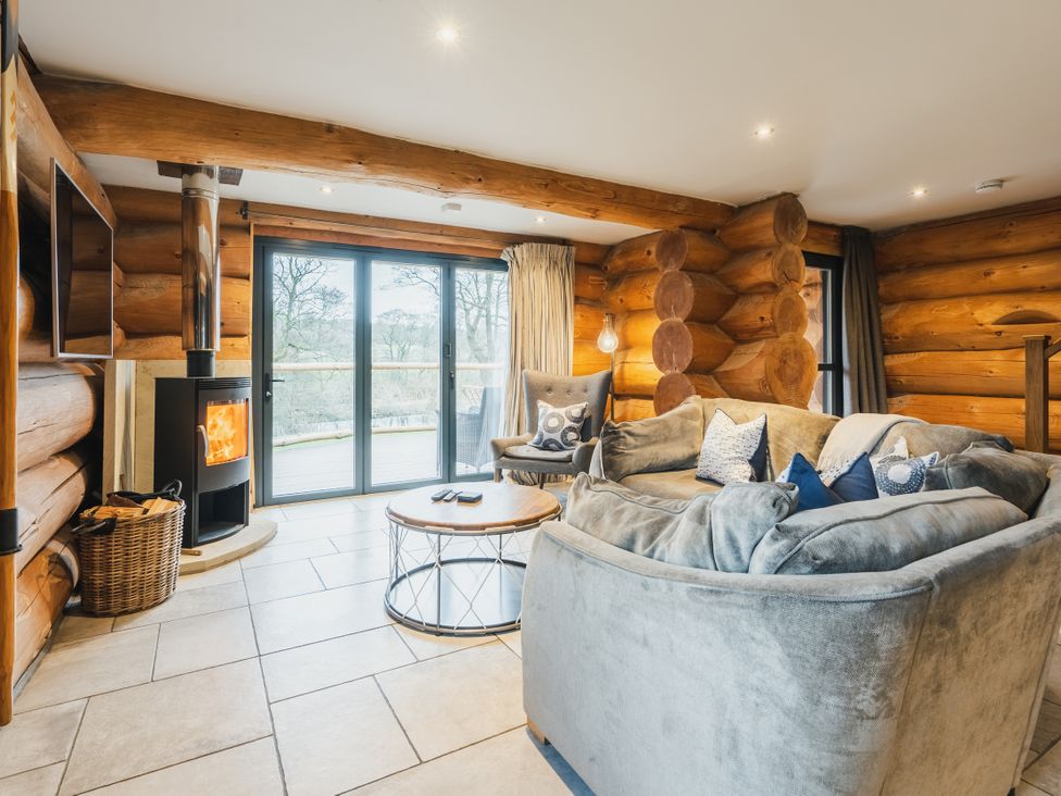 A living room with a sofa and fireplace at The Lookout in Addingham