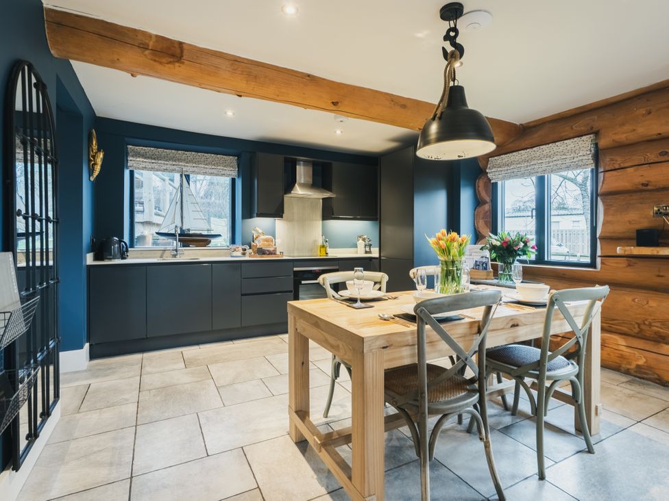 A kitchen with a table and chairs at The Lookout in Addingham